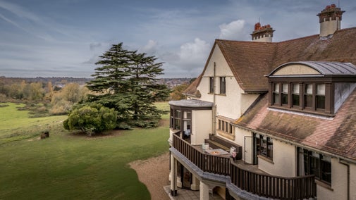 An aerial view of Deben View's balcony with outdoor dining furniture, which overlooks Sutton Hoo, Suffolk